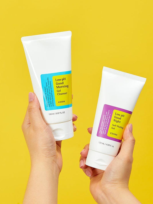 Hands holding COSRX Low pH Good Morning Gel Cleanser and Goodnight Soft Peeling Gel